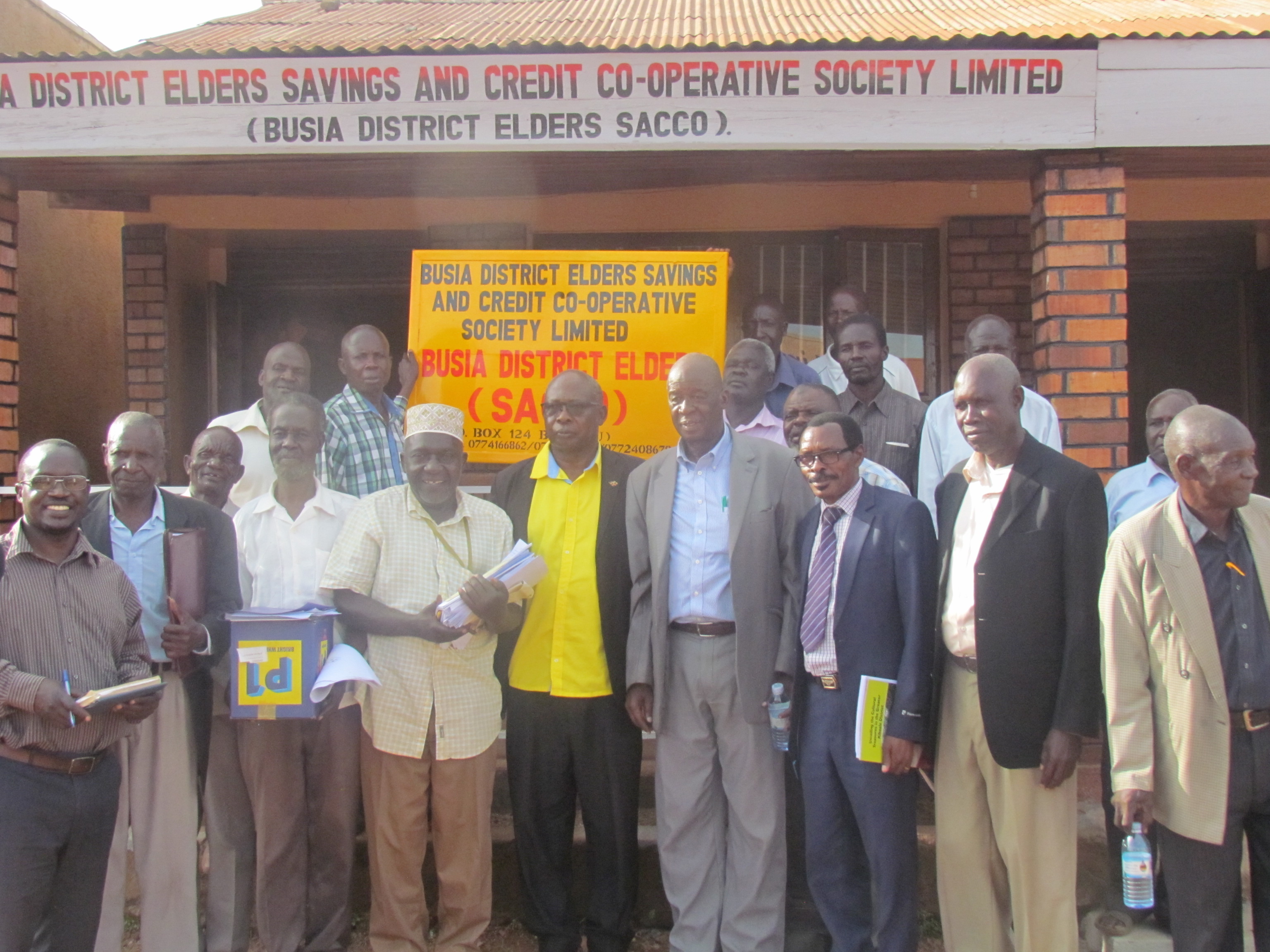 Older persons in the goup photo at the newBusia district elders sacco