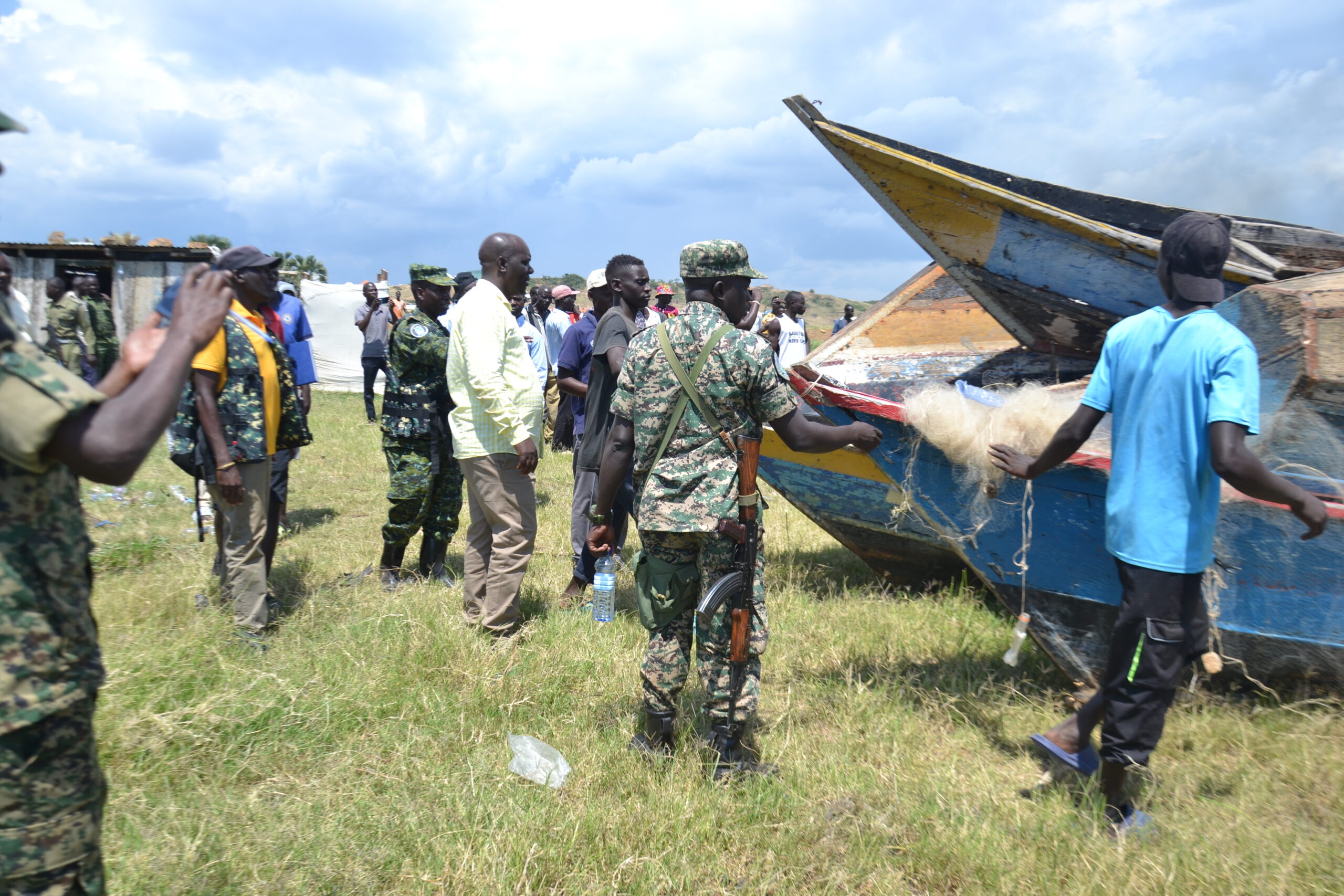 Fisheries Protection Unit officers inspecting illegal fishing gear at Kaiso landing site (Photo by Peter Kugonza).
