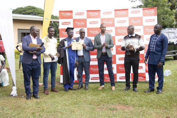 Some of the members of Lira City Painters Association pose with their certificates awarded to them after undergoing training. Photo by Marion Ajwang.